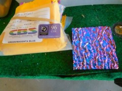 Dichroic Glass:CBS 96COE Green/Magenta/Blue on Granite Ripple Texture Black-3″Sq